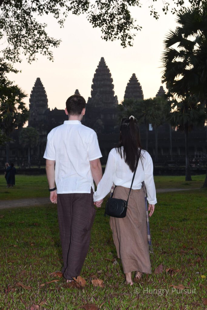 Cambodia Blog Posts Happy couple holding hands, exploring Angkor Wat, a UNESCO World Heritage Site in Cambodia