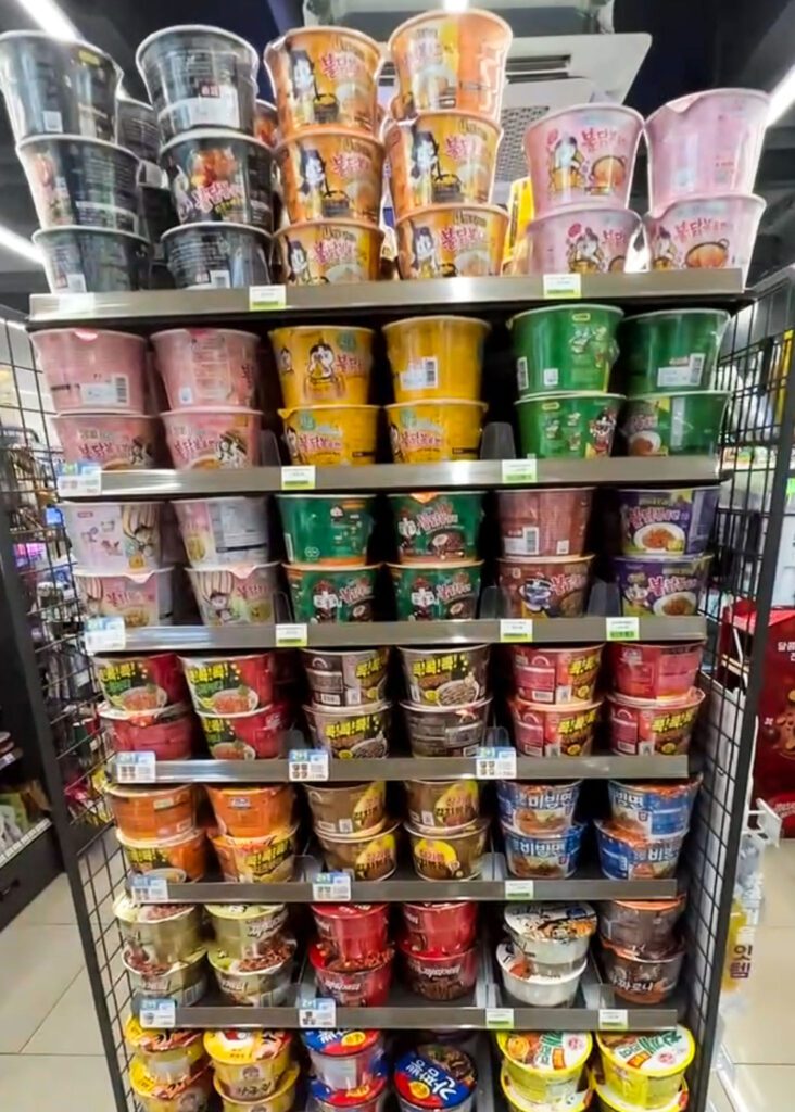 a shelf of ramen at the korean convenience store