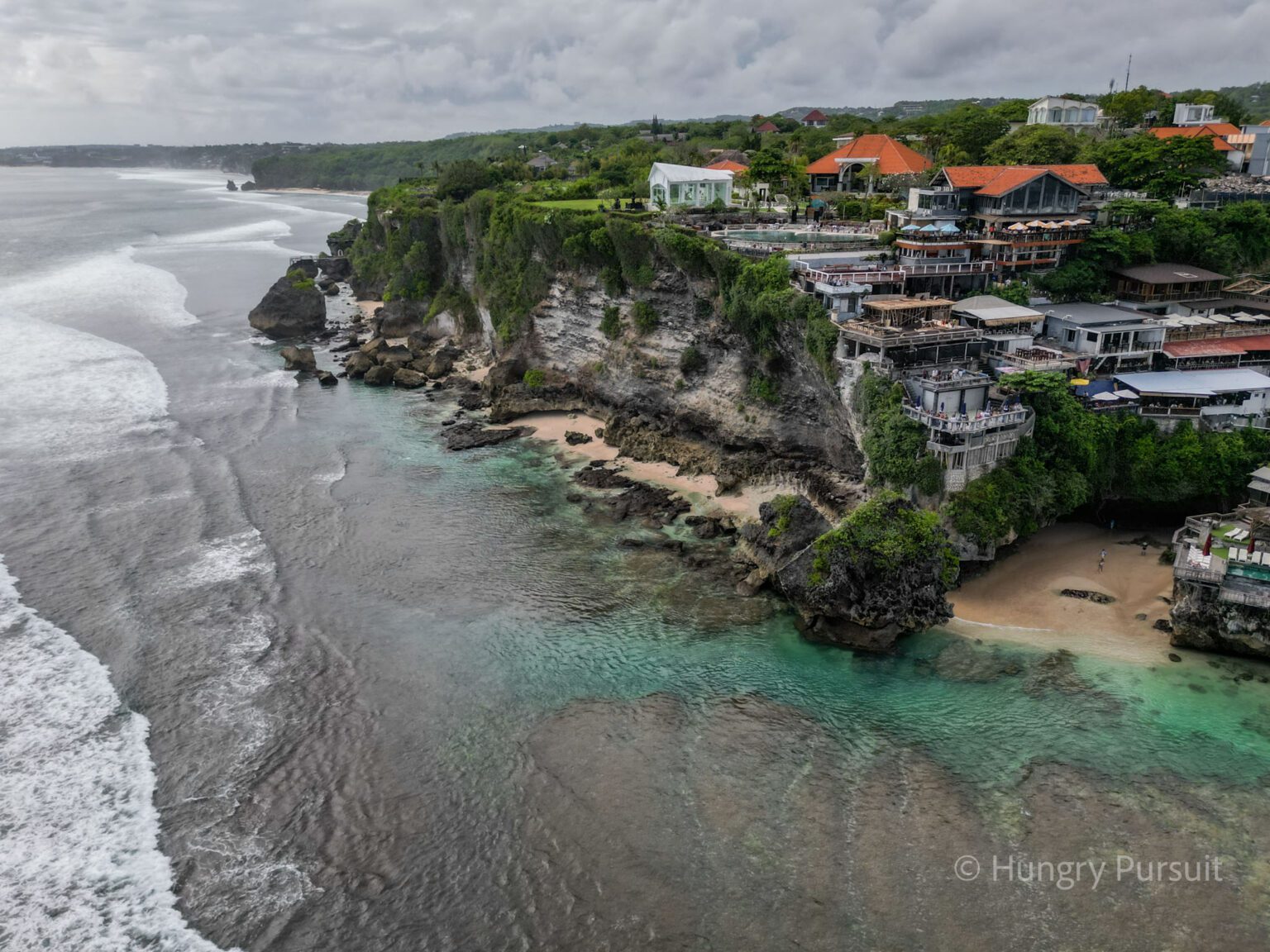 Things to Do in Uluwatu Suluban Beach View from the drone side view