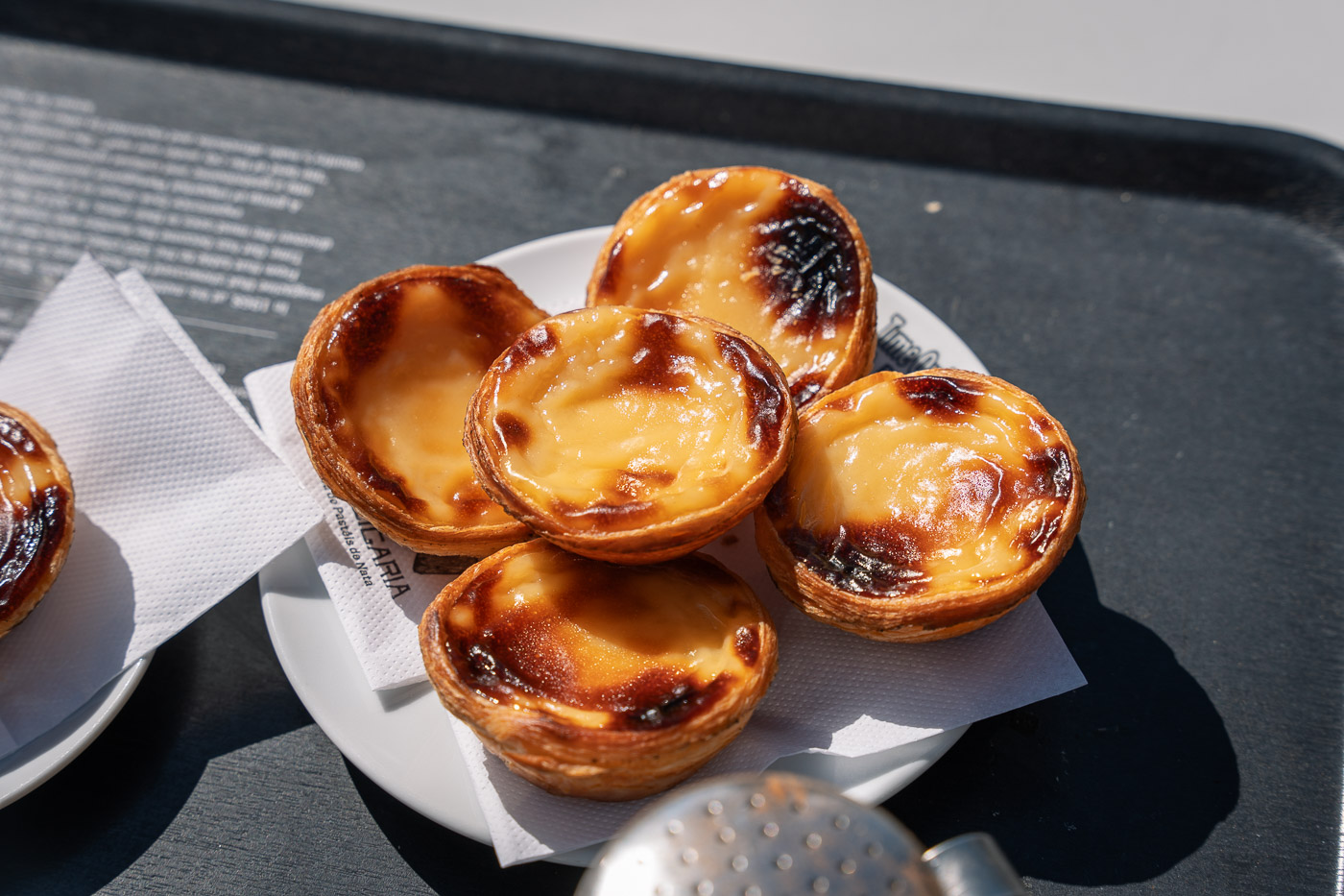 a plate of pastel de nata, Portuguese custard tarts, first stop on this 1 day in Porto itinerary.