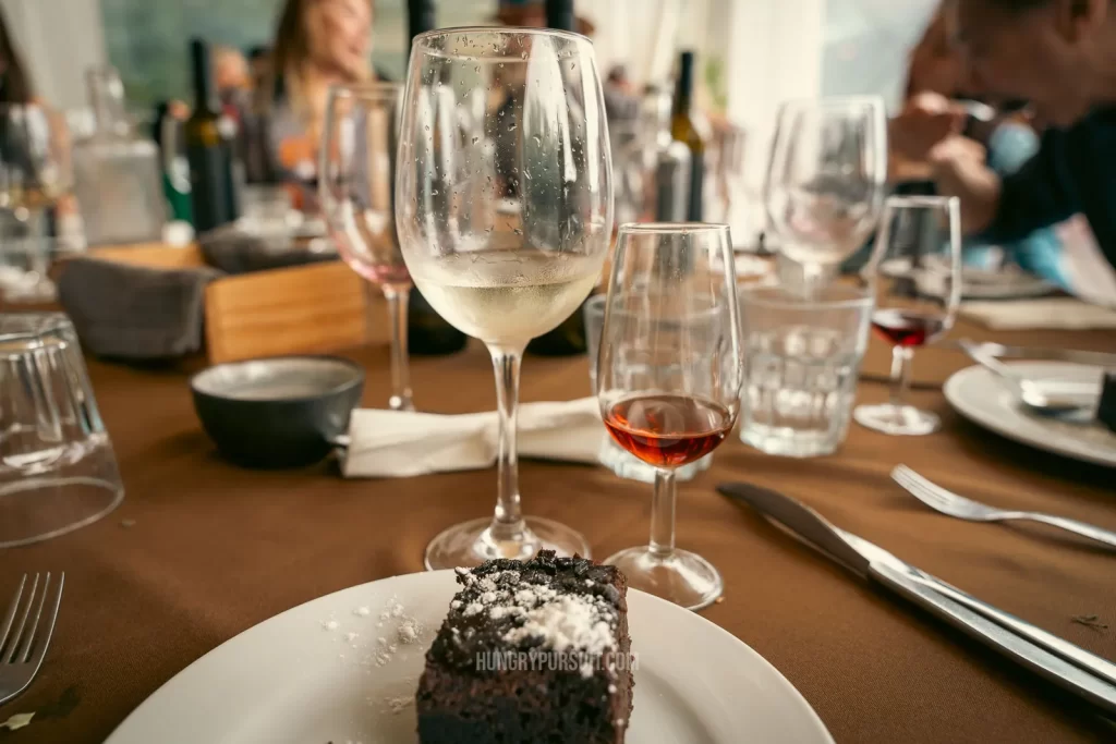 a glass of port wine and cake at lunch on the best Douro valley wine tour; Douro valley wine tour tasting