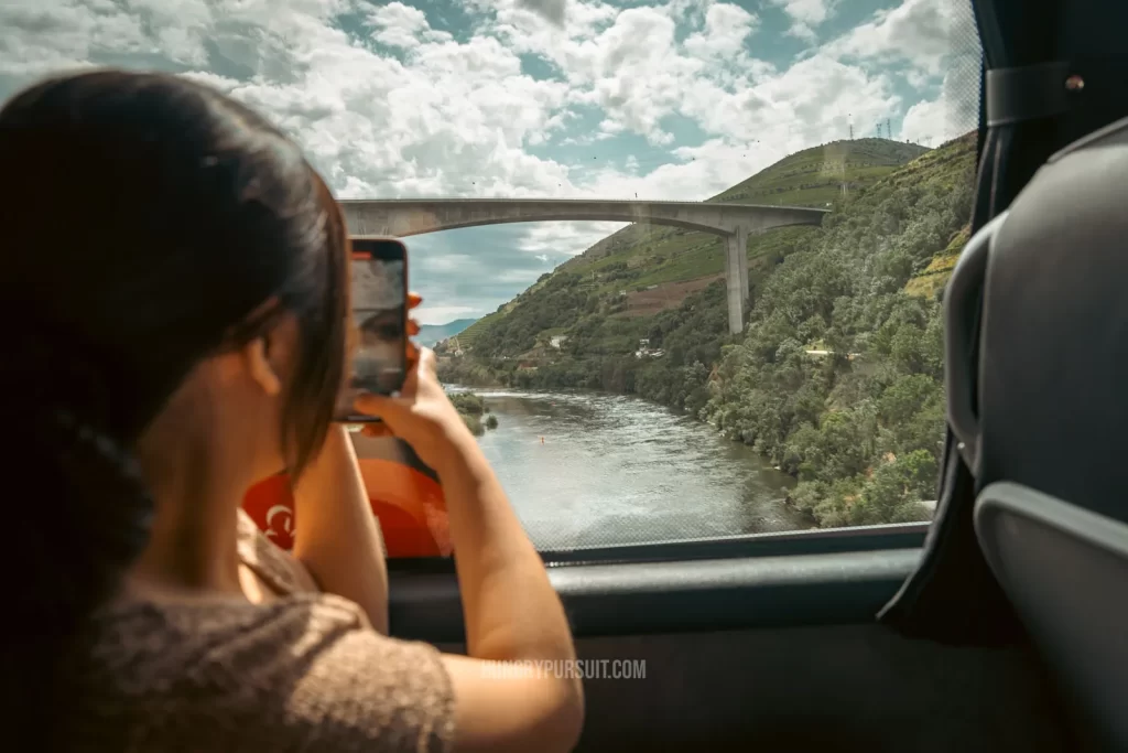 best Douro valley wine tour, woman looking through window on bus