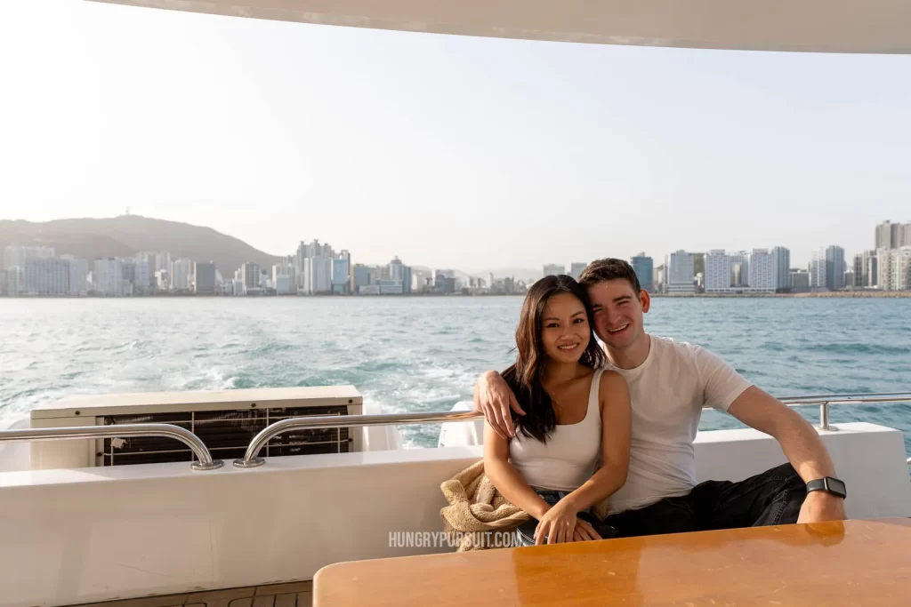 Couple sitting inside busan yacht on a tour