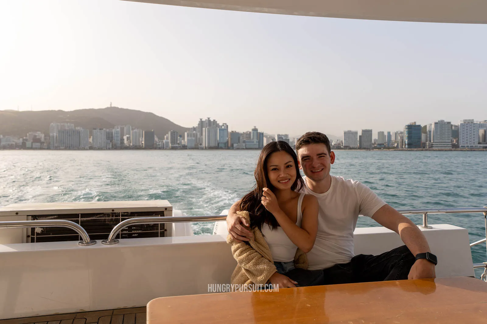 a man and women on yacht in busan; things to do in busan