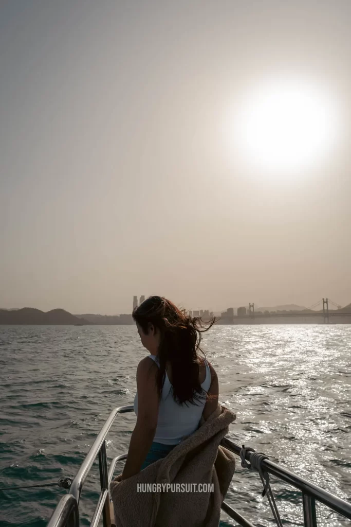 Posing on busan yacht cruise at sunset