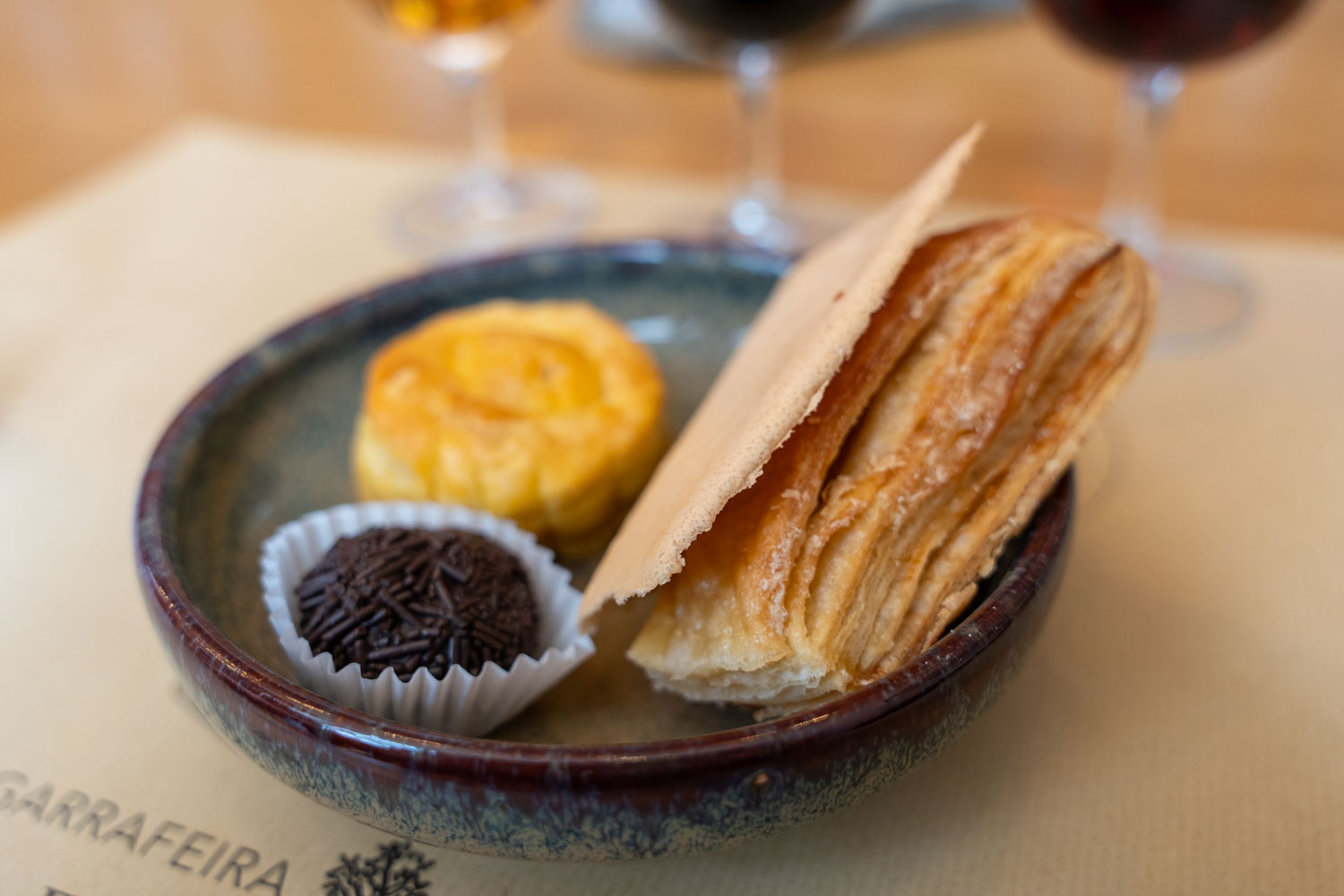 a picture of 3 sweet Portuguese treats in a wine bar; 2 days in porto itinerary.